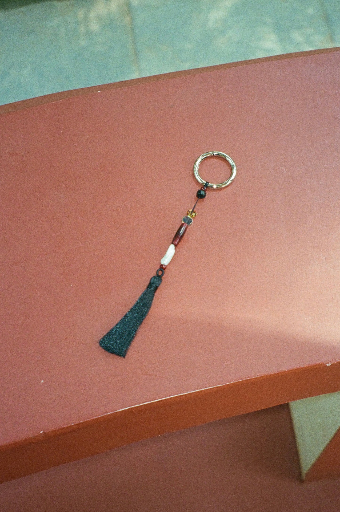 TASSEL CHARM